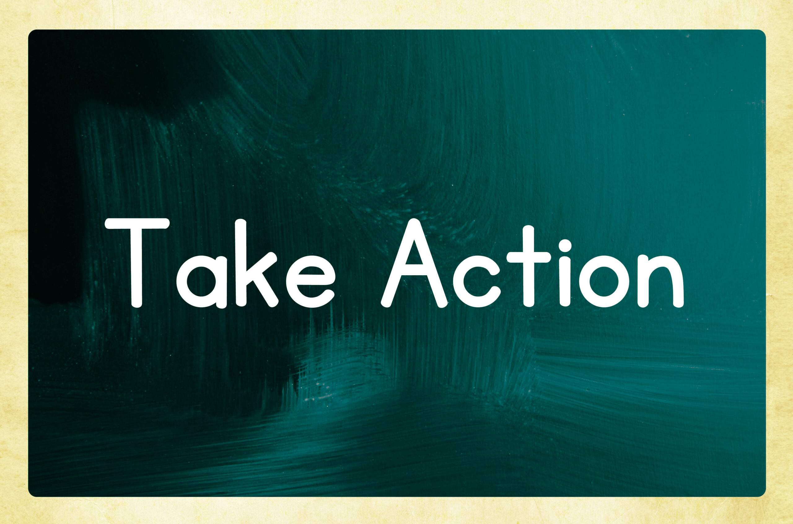 Chalkboard with "Take Action" written on it