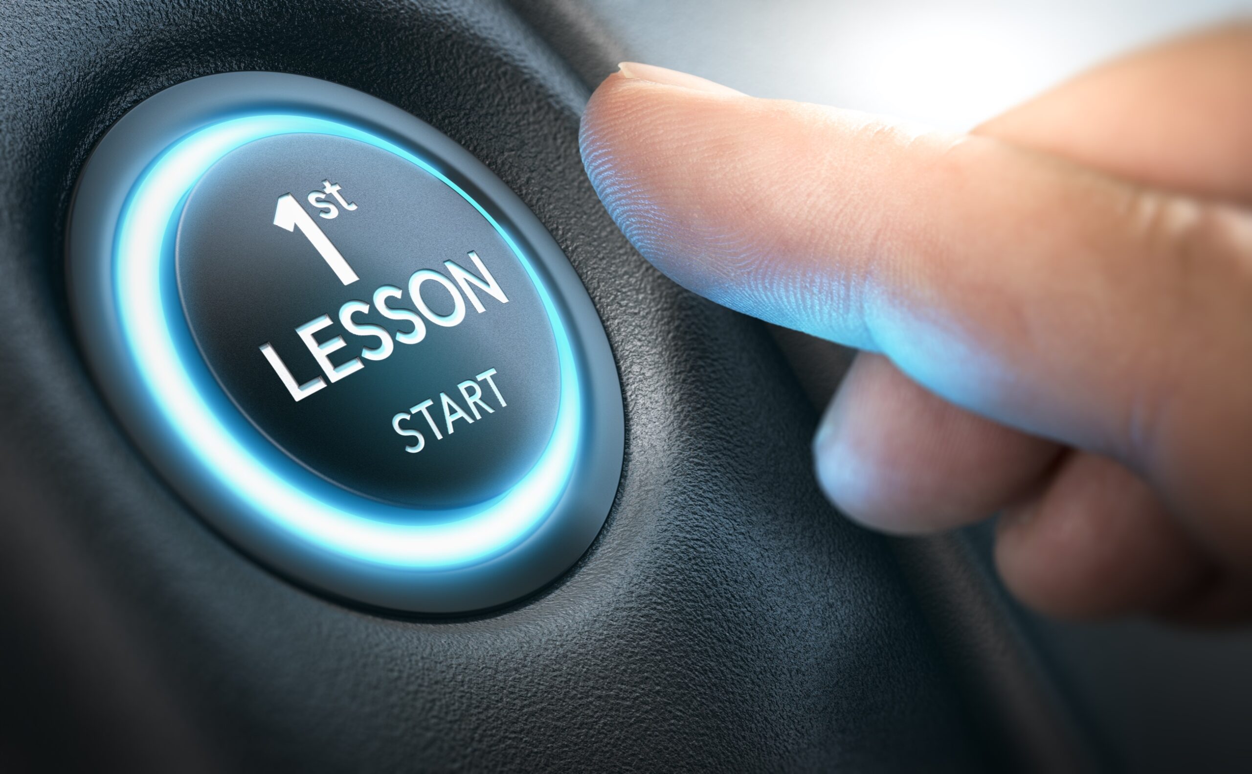 START - Image of a person's thumb about to press a button labelled "1st Lesson Start"